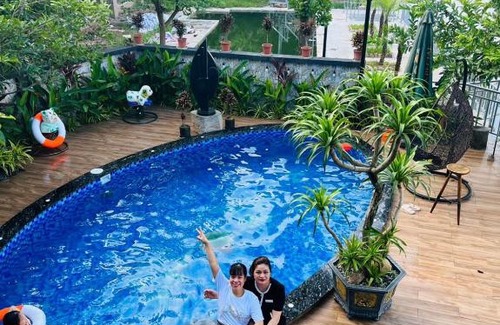 Soc Son Apartment | Relax at Lakeside Garden: Pet-Friendly Oasis with Pool