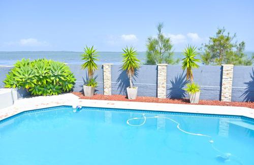 Tegerin House | Elegant Lakeside Retreat with Pool: Rated 9/10 by Guests