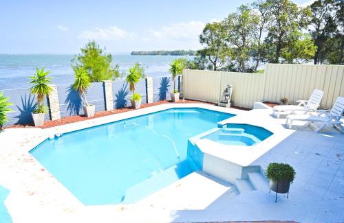 Tegerin House | Elegant Lakeside Retreat with Pool: Rated 9/10 by Guests