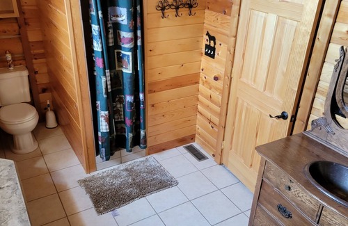 Hulett House | Inviting Log Home on Golf Course with Bike Garage & Kitchen