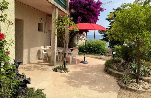 Conca Apartment | Garden Apartment Steps from Tarco Beach with Ocean Views