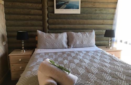 Lakes Entrance Apartment | Relaxing Lazy Acre Log Cabins with Pool & Ocean View