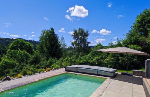 Le Grand Valtin Ski Chalet | Relax at Le Cerf: Pool, Ocean Views & High Guest Ratings