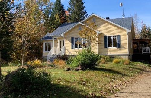 Mandeville Apartment | Experience Le Chalet Jaune: Child-Friendly Retreat, Rated 10/10