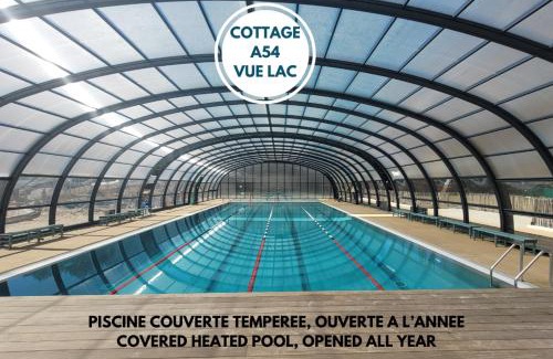 Leon Apartment | Relax at Le Cottage Vue Lac with Pools and Scenic Views