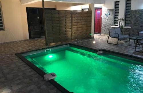 Saint-Andre Apartment | Relax at Le Flamboyant: Pool, Jacuzzi & Pet-Friendly Stay
