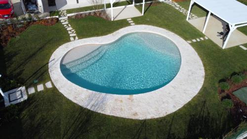 Sirolo House | Discover Le Nereidi Green Resort: Poolside Oceanfront Escape