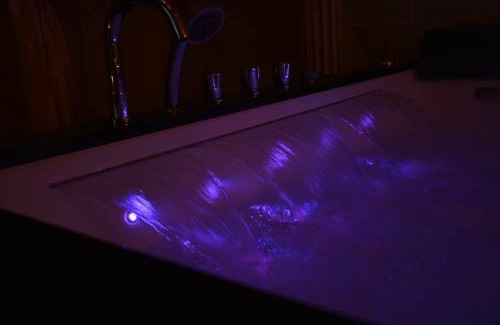 Vernon Apartment | Indulge in Relaxation at Le Petit Versailles with Spa & Hot Tub