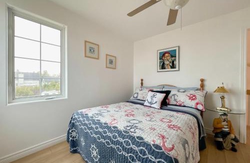 Val-Comeau Bed & Breakfast | Explore Le Phare des Dunes with Oceanfront Views