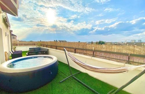 Le Blanc-Mesnil Apartment | Relax at Le Sunset Terrace with Hot Tub & Pool Near Paris