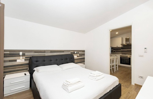 Zona XXX Castel Fusano Apartment | Discover Le Querce: Family-Friendly Retreat in Rome