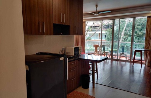 Calangute Apartment | Relax at Leisurebay Waves: Poolside Bliss Awaits You