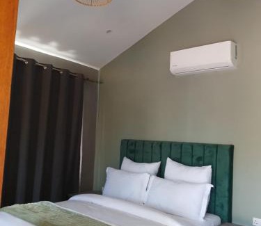 Central Cabin | Explore Leropong Manor: Top-Rated Stay with Pool & Spa