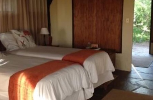 Muneambuanas Cabin | Experience Nature at Lianshulu Bush Lodge with Pool & Dining
