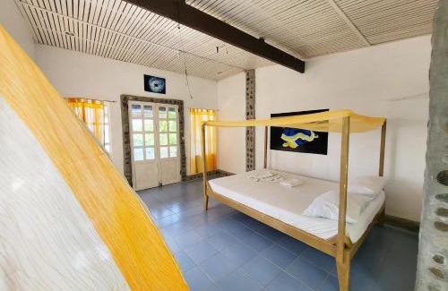 Dauin Hotel | Cozy Liberty's Community Lodge: Oceanfront Diving Retreat