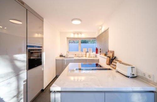 Starnberg House | LIBORIA: Stylish Retreat with Sauna and Oceanfront Spa