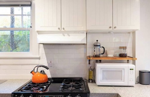 Bushrod Condo | Bright Retreat with Outdoor Space and Ocean Views