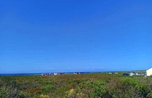 Kleinbaai Villa | Beachfront Lighthouse Villa Romansbaai with Hot Tub & More