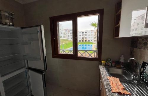 M'diq Apartment | Relax at Lilac's Garden with Pool and Ocean Views