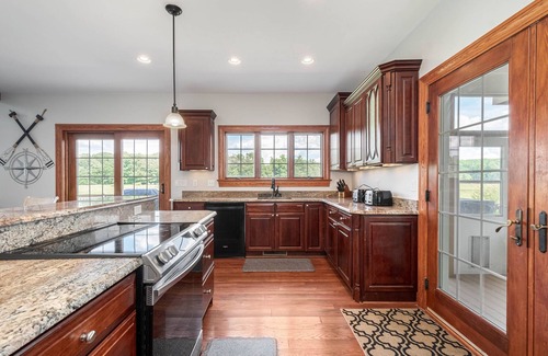 Waterfront Greens House | Unforgettable Retreat | Indoor Pool, Spa & Game Room Bliss