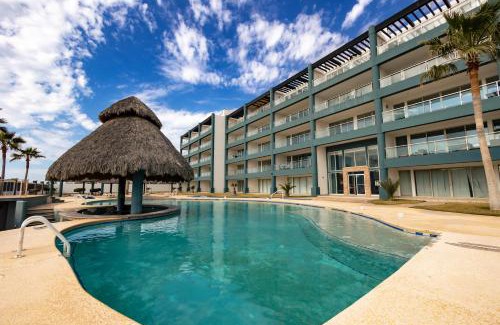 Las Conchas Apartment | Linda Vista 401: Perfect Poolside Retreat for Families