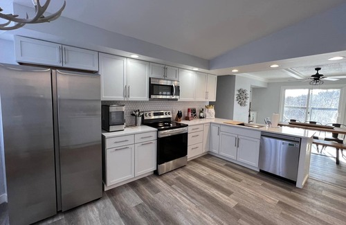 King House | Waterfront Haven: Lion on Otter Lake with Private Pier