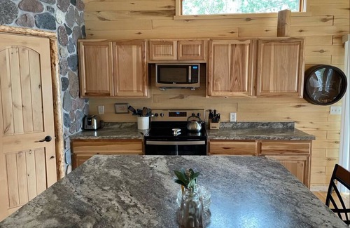 Grand Rapids Cabin | Cozy Little Red Cabin by Beautiful Lake Wabana!