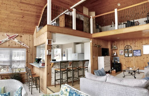 Chippewa Lake House | Charming Little White Cottage by Chippewa Lake with Views
