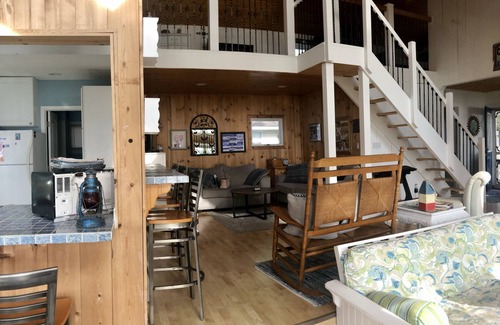 Chippewa Lake House | Charming Little White Cottage by Chippewa Lake with Views