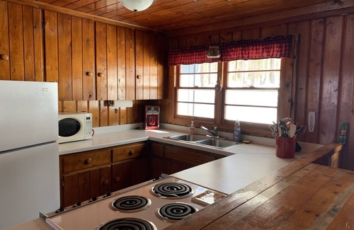 Wetmore Cabin | Serene Lakefront Cabin Near Munising with Canoe & Rowboat