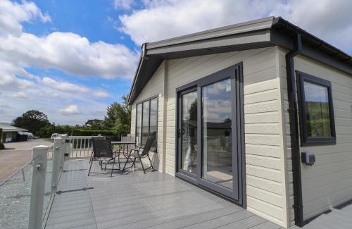 Saint Asaph House | Discover Lodge 3: Pet-Friendly Haven with Private Pool