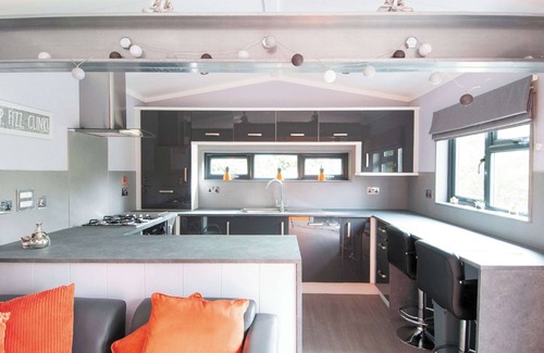 Low Newton Ski Chalet | Cozy Lodge with TV, Spa & Kitchen for Family Getaways