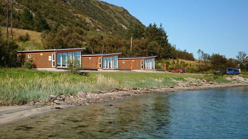 Vestvagøy Cabin | Oceanfront Lofothytter: Rated 10/10 with Cozy Fireplace