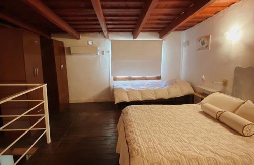 Centro Apartment | Charming Garden Loft: Child-Friendly Getaway with High Ratings