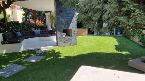 Ujlak Villa | Relax in Loft Garden Villa: 4BR, Family-Friendly Oasis