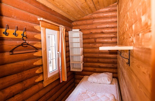 Sønderstrand Cabin | Cozy Log Cabin Retreat with Horse Stables by the Sea
