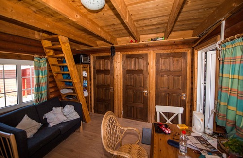 Sønderstrand Cabin | Cozy Log Cabin Retreat with Horse Stables by the Sea