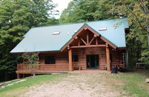 Northeast Michigan Cabin | Tranquil Log Cabin Retreat with Pool and Spa Amenities