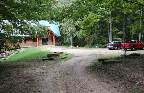 Northeast Michigan Cabin | Tranquil Log Cabin Retreat with Pool and Spa Amenities