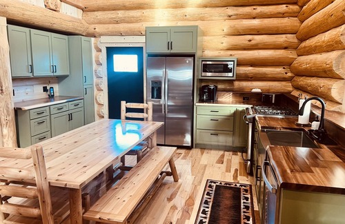 Levering Cabin | Cozy Log Cabin Minutes from Lake Michigan with Pool Access