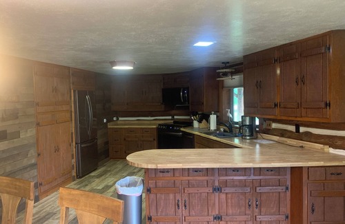 Irma Cabin | Idyllic Log Cabin Retreat with Private Lake and Pool