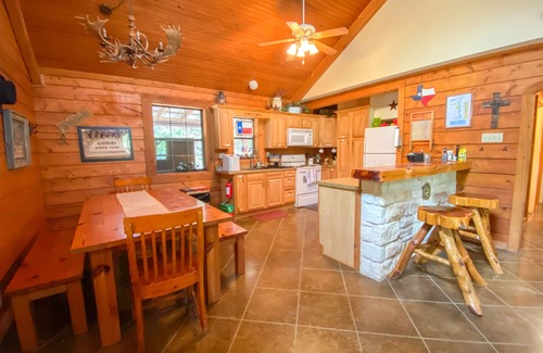 Sabinal House | Inviting Log Cabin on River Road with Pool and Breakfast