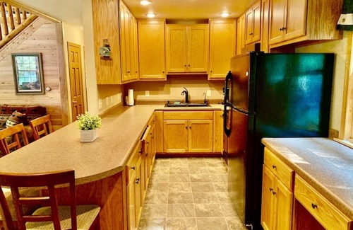 Lansing Cabin | Cozy Log Cabin with Hot Tub & Pool, Rated 9.8 by Guests
