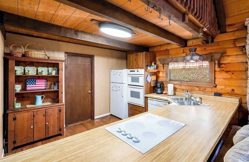 Great Cacapon Cabin | Cozy Log Cabin with Hot Tub, Deck & WiFi for Your Stay