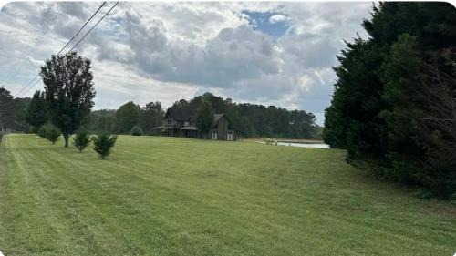 Bowdon Junction House | Log Castle and a spring-fed lake