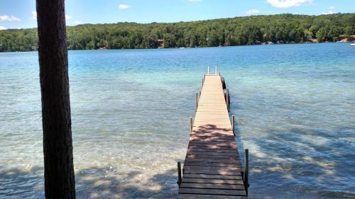 Kalkaska House | Experience Log Cottage on Blue Lake with Private Beach Access