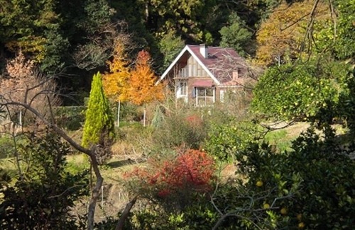 Hata-gun Cottage | Idyllic Log Guest House with Expansive Lawn & Spa Retreat