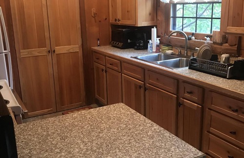 Eagle River House | Tranquil Log Home Retreat in Eagle River with Pool & Lake View