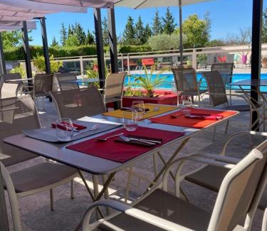 Caissargues Hotel | Inviting Logis Hôtel Restaurant Les Aubuns with Pool & Ocean Views