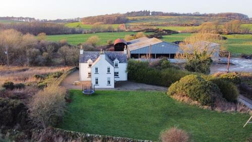 Whithorn House | Inviting Longhill Farmhouse: 4-Star Stay with Breakfast & Pets